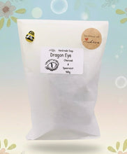 Load image into Gallery viewer, dragon Gift | dragon eye gift, dino gift, alternative gift, Dragon / Dinosaur Eye Vegan Soap Wooden display easels are available to purchase on a separate listing  Calling all fantasy lovers! Step into a realm of mystical charm with our captivating dragon / dinosaur eye soap. This soap is vegan, cruelty free and available in your choice of colour and essential oil. All our soaps are made with natural clays and essential oils to gently cleanse and nourish your skin. eco conscious gift
