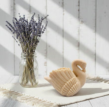 Load image into Gallery viewer, A beautiful handmade vegan soap in the shape of a graceful swan with detailed wing feathers, displayed against a whimsical background for an elegant farmhouse decor gift. 
