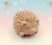 Load image into Gallery viewer, Handmade vegan soaps featuring a cute waving hedgehog, packaged in beautiful eco friendly packaging. crafted with natural French clays, activated charcoal and essential oils. a eco-friendly, zero waste gift that’s cruelty-free, skin-nourishing, the perfect gift for hedgehog lovers and animal lovers. small business UK
