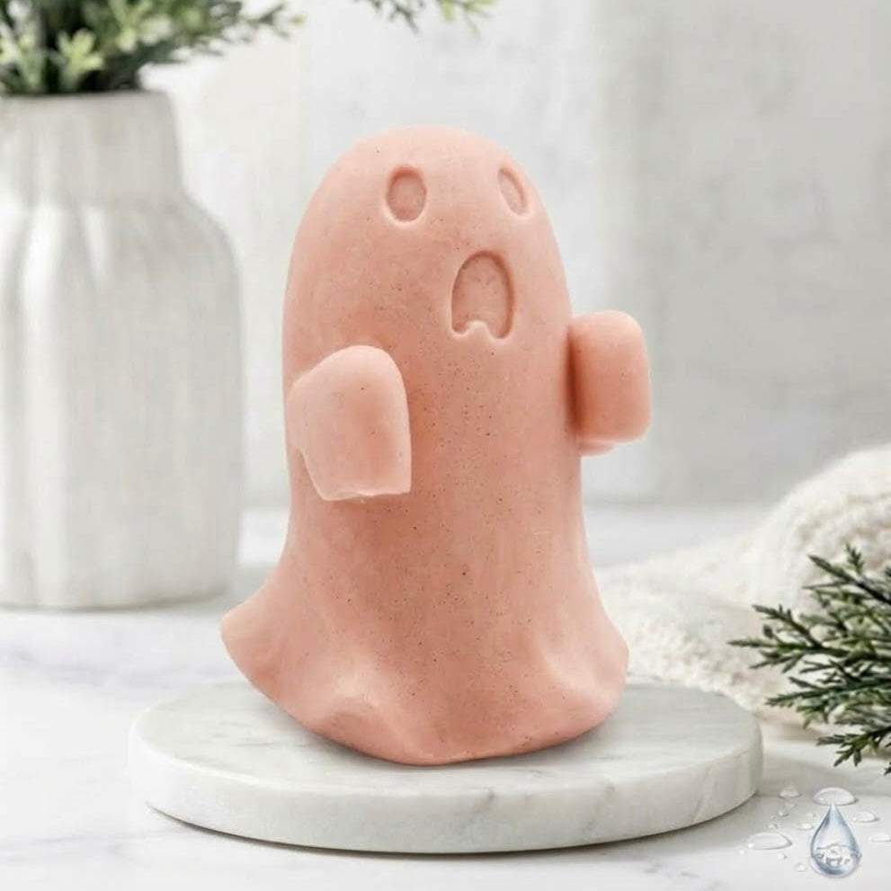 A soft pink ghost soap gift on a marble base.