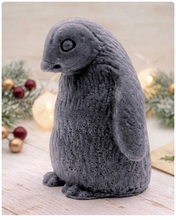 Load image into Gallery viewer, handmade vegan soap in the shape of a realistic young penguin sculpture, featuring a soft downy fur texture and a gentle expression, displayed in a bright farmhouse decor setting.
