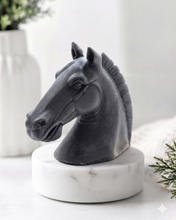 Load image into Gallery viewer, Grey horse head vegan soap sculpture gift on a wooden floor with decorative elements in the background
