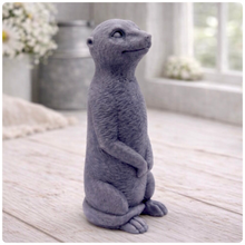 Load image into Gallery viewer, A highly detailed handmade vegan soap, sculpted in the shape of a realistic meerkat standing upright in its iconic sentinel pose, featuring textured fur and a curious facial expression, displayed on a light wooden surface.
