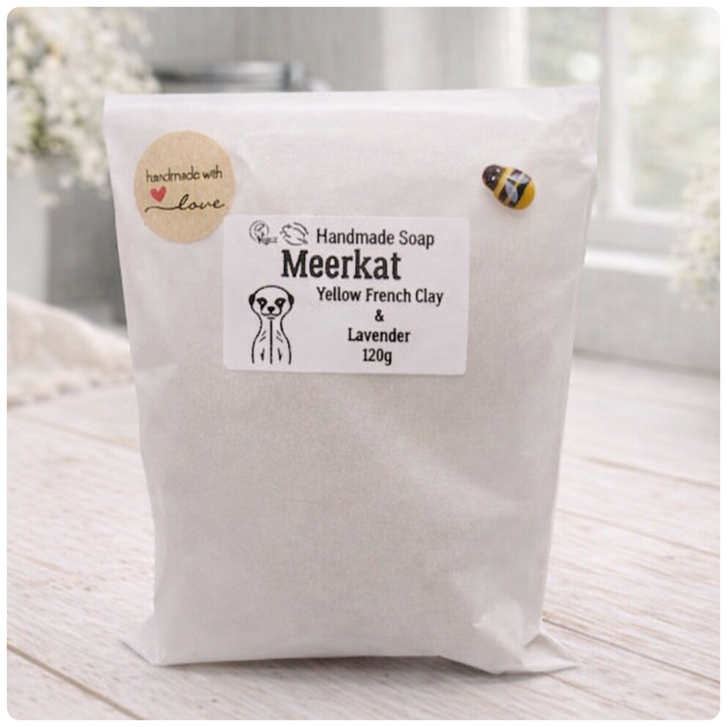 Handmade soap package with a label on a light wooden surface