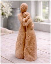 Load image into Gallery viewer, handmade vegan soap, sculpted as a mother and daughter in a tender standing embrace, featuring an intricate embossed floral and vine pattern on their dresses.
