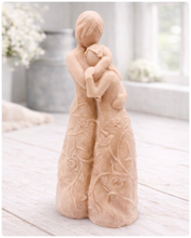 Load image into Gallery viewer, handmade vegan soap, sculpted as a mother and daughter in a tender standing embrace, featuring an intricate embossed floral and vine pattern on their dresses.
