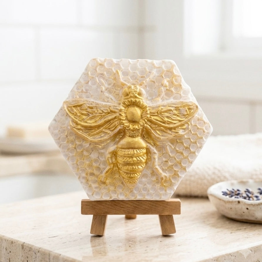 handmade vegan soap gift featuring a detailed honey bee in shimmering gold, displayed on a wooden easel