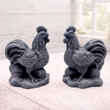 Load image into Gallery viewer, Two handmade vegan soaps sculpted in the shape of proud roosters (cockerels) with detailed feathers, combs, and curved tail feathers, standing on a rustic base, in a natural colour. Gift boxed 
