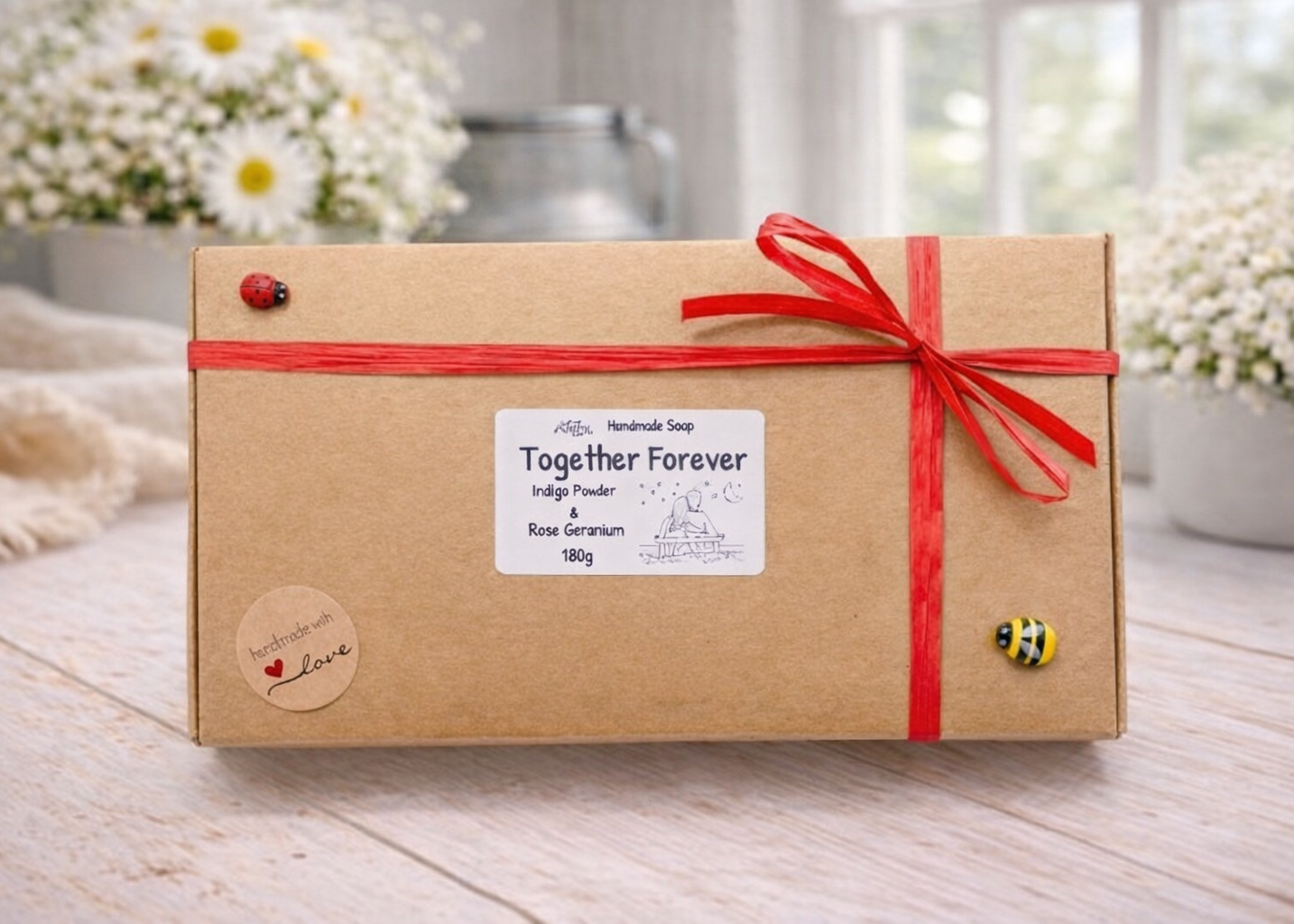 This gift set features a stunning soap sculpture of a man gently embracing a woman alongside a charming rose-adorned heart soap, stamped with the heartfelt message "I LOVE U".