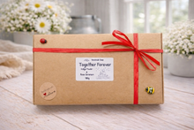 Load image into Gallery viewer, This gift set features a stunning soap sculpture of a man gently embracing a woman alongside a charming rose-adorned heart soap, stamped with the heartfelt message "I LOVE U".
