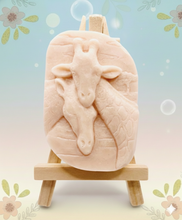 Load image into Gallery viewer, Handmade vegan soaps featuring two nuzzling giraffes in beautiful eco friendly packaging. crafted with natural French clays, activated charcoal and essential oils. a eco-friendly, zero waste gift that’s cruelty-free, skin-nourishing, the perfect gift for giraffe lovers, or for animal lover gifts. small business UK
