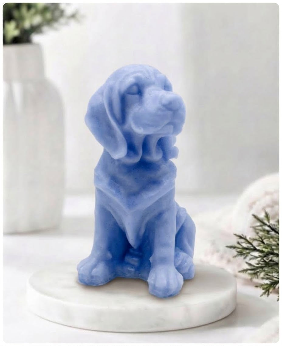 A light blue Golden Retriever soap sitting on a white marble display stand with a soft bathroom background.