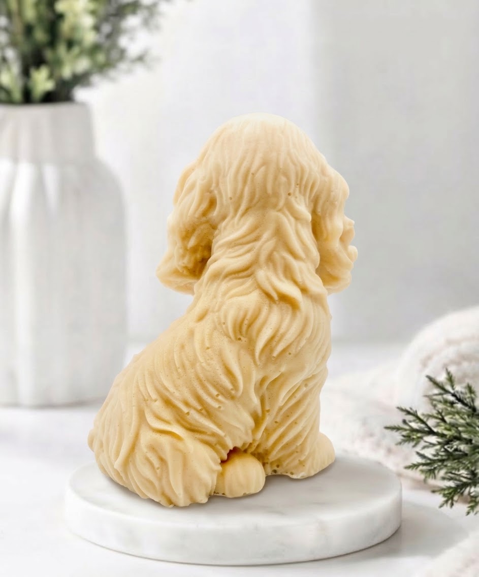 Handmade springer spaniel vegan soap sculpted in a sitting pose with textured fur and detailed floppy ears, resting on a marble display pedestal.
