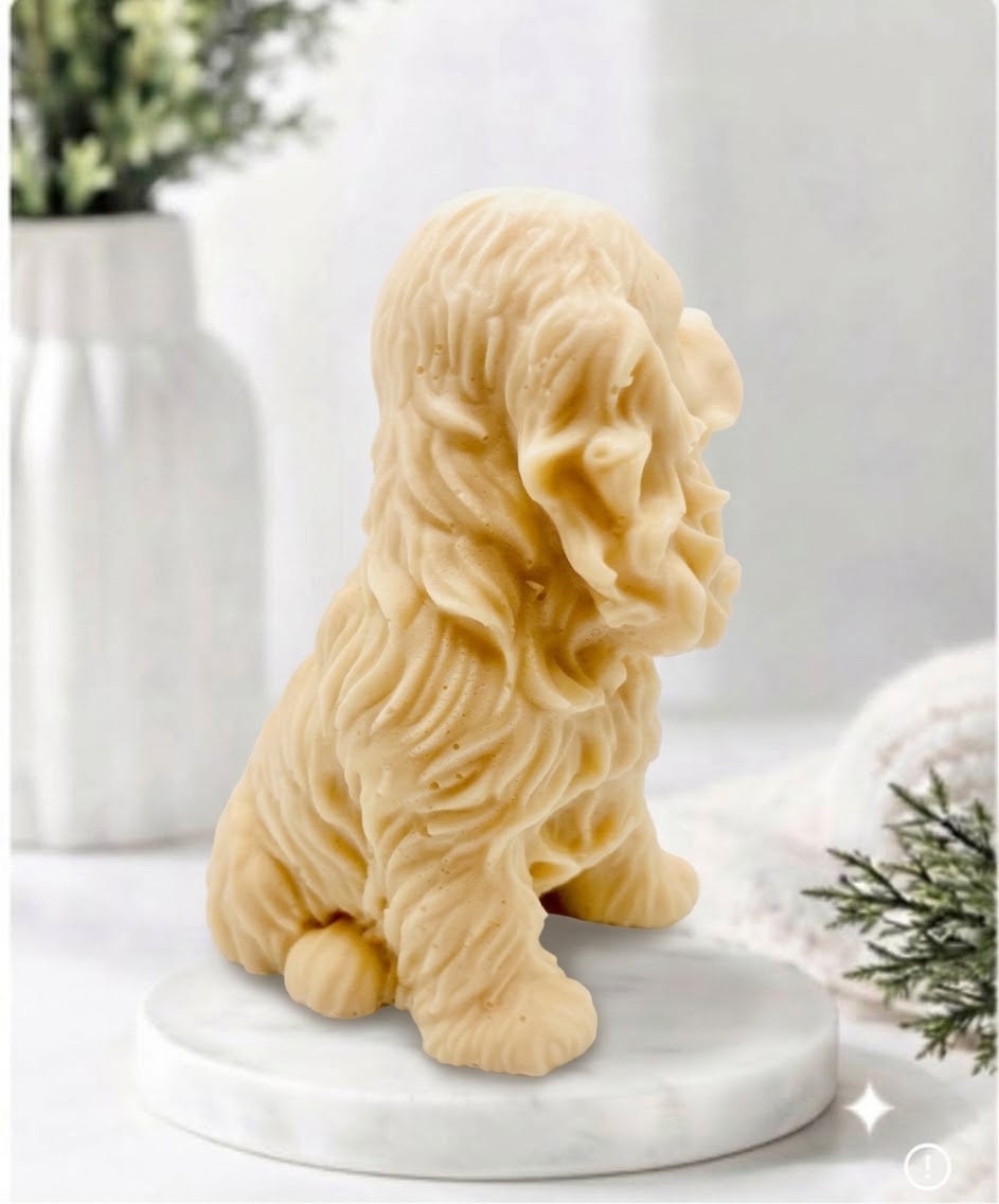 Handmade springer spaniel vegan soap sculpted in a sitting pose with textured fur and detailed floppy ears, resting on a marble display pedestal.