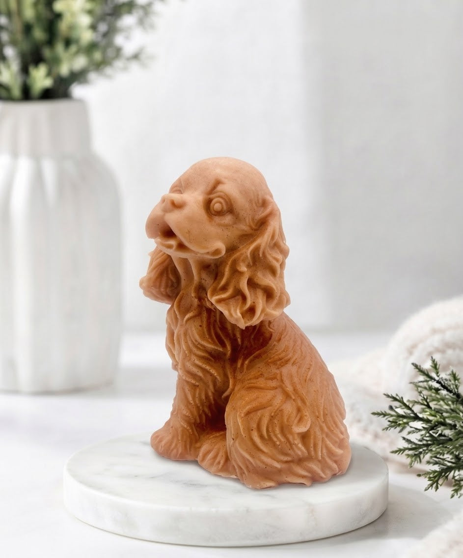 Handmade springer spaniel vegan soap sculpted in a sitting pose with textured fur and detailed floppy ears, resting on a marble display pedestal.