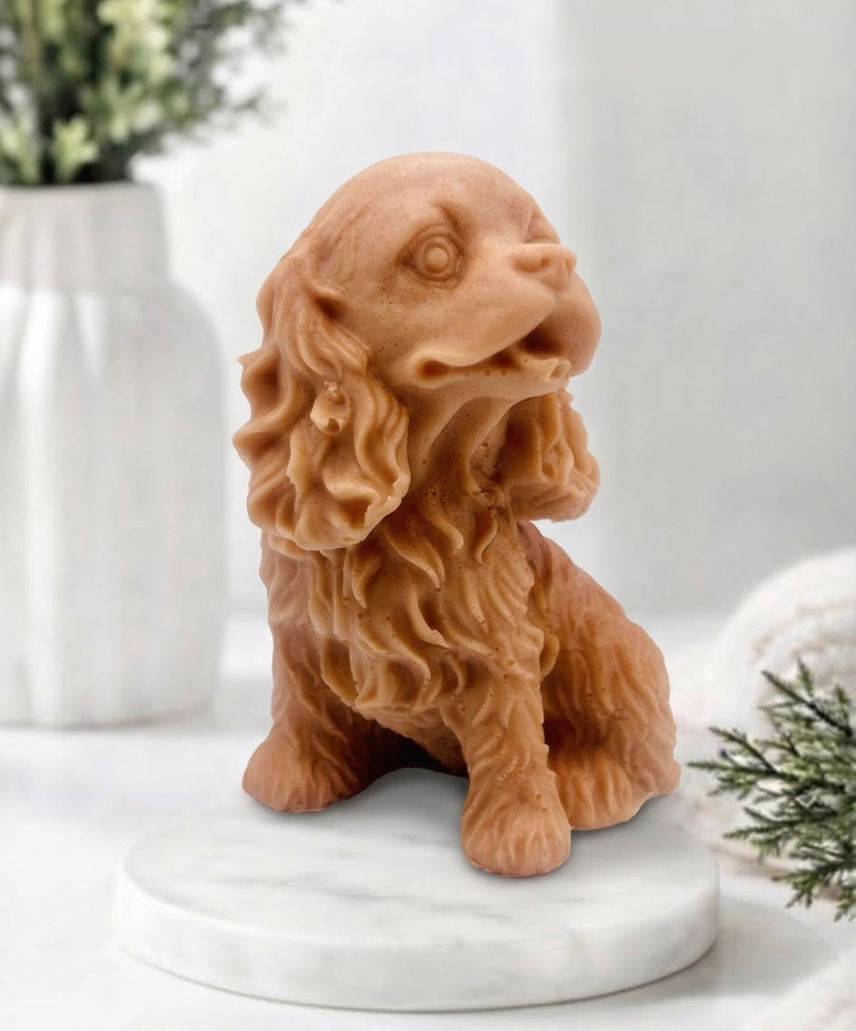 Handmade springer spaniel vegan soap sculpted in a sitting pose with textured fur and detailed floppy ears, resting on a marble display pedestal.
