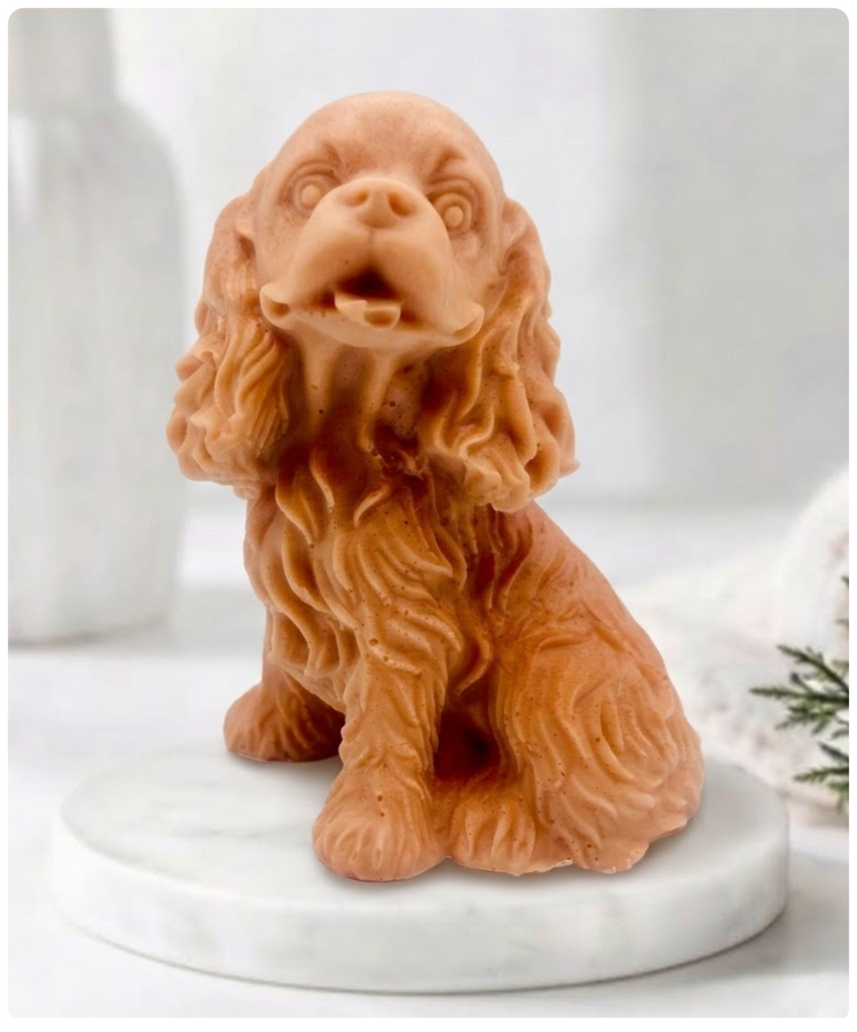 Handmade springer spaniel vegan soap sculpted in a sitting pose with textured fur and detailed floppy ears, resting on a marble display pedestal.