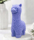 handmade vegan soap in the shape of a realistic standing alpaca sculpture, featuring detailed curly wool texture and a smiling face, displayed on a rustic white wooden surface in a bright farmhouse decor setting.