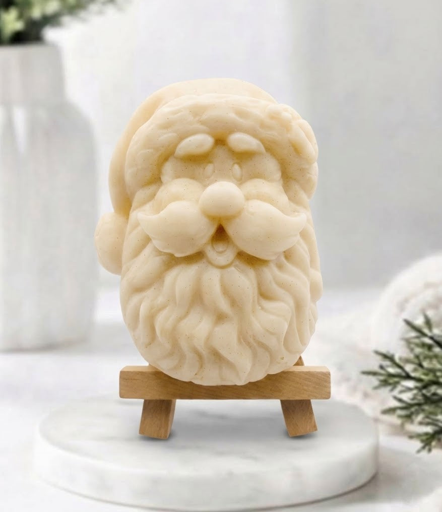 handmade yellow vegan soap sculpted in the shape of Father Christmas's head, featuring a detailed curly beard, a jolly moustache, and a classic Santa hat.