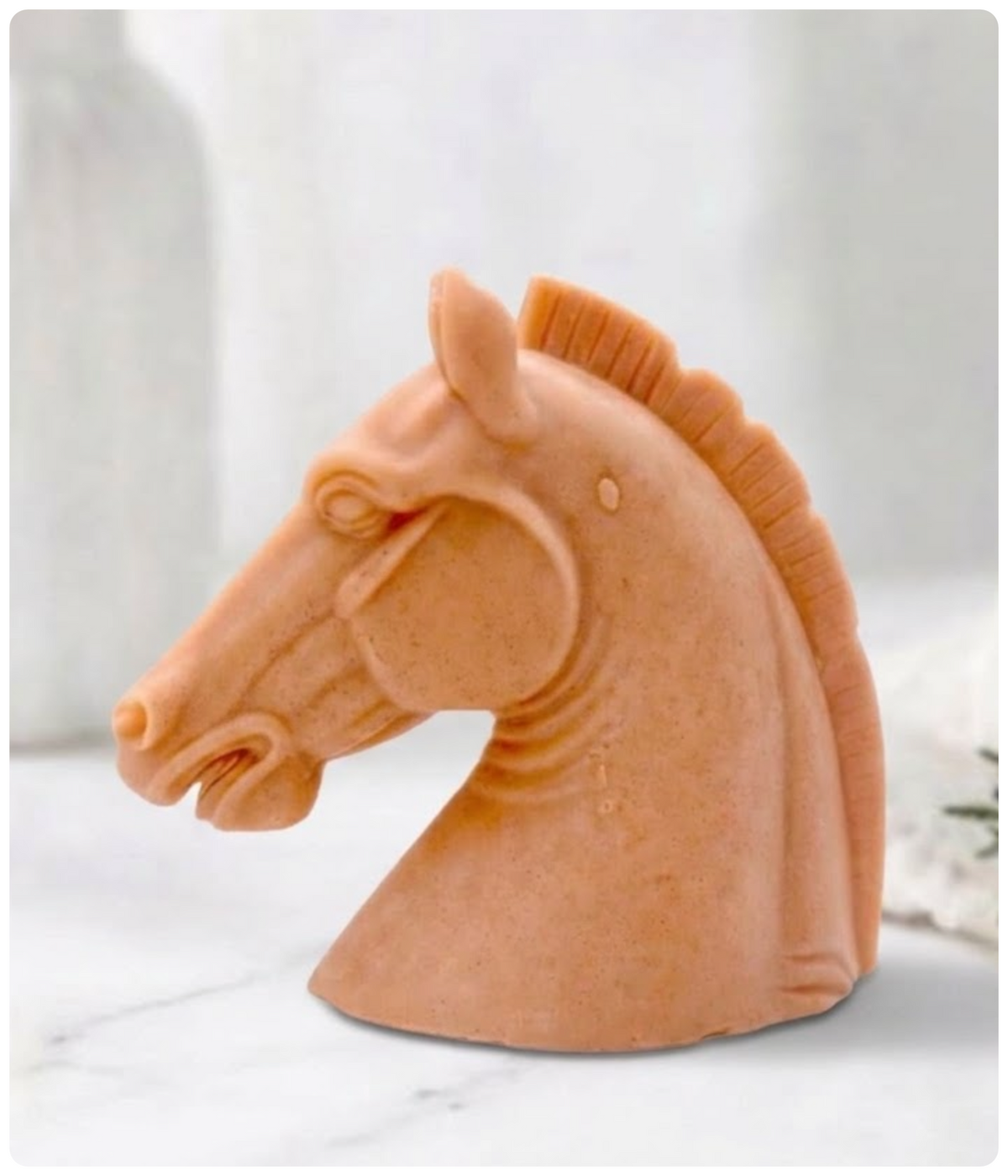 Handmade terracotta horse head soap bar featuring natural red French clay and a carved equestrian design.