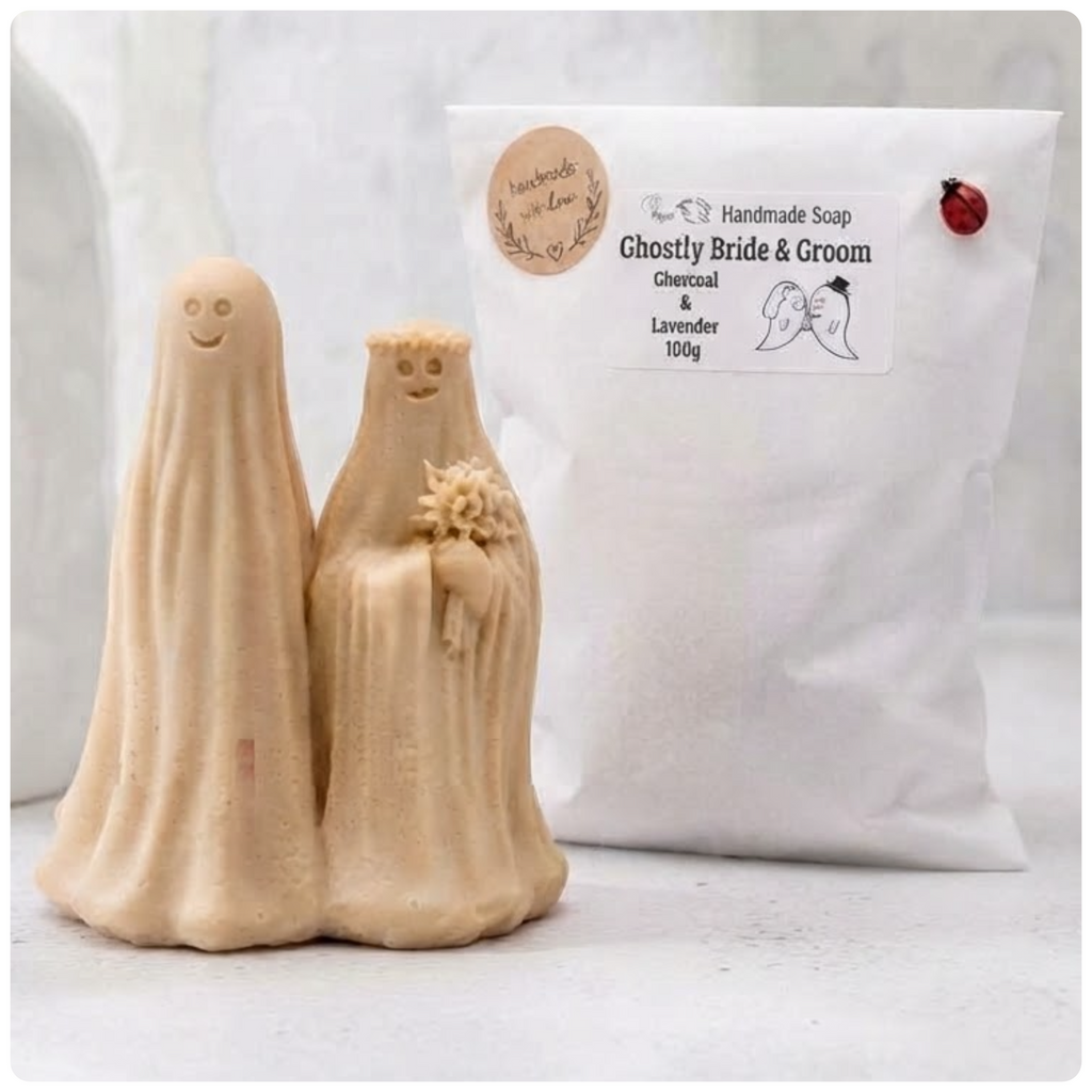 handmade vegan soap featuring a ghostly bride with a bouquet and a groom, a unique farmhouse decor wedding or anniversary gift, displayed next to beautiful eco friendly packaging 