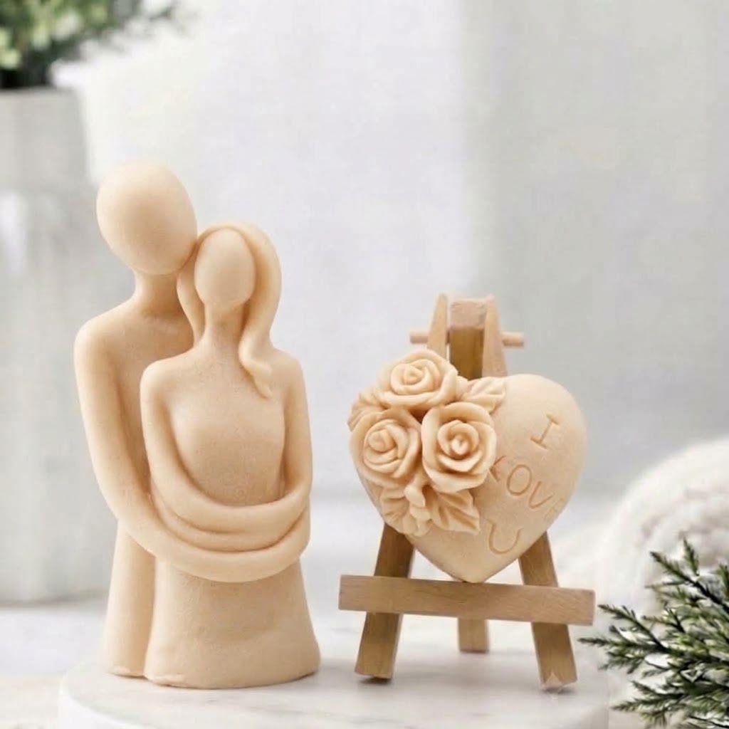 This gift set features a stunning soap sculpture of a man gently embracing a woman alongside a charming rose-adorned heart soap, stamped with the heartfelt message "I LOVE U". Handmade in a soft yellow colour 