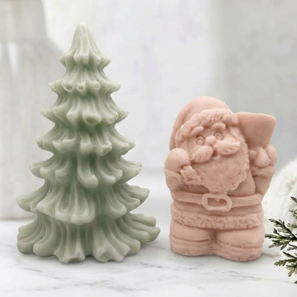 Handmade Santa and Christmas Tree soap gift set featuring a green pine tree and pink Santa figurine. Perfect for holiday gifting.