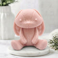 Handmade soft pink vegan soap featuring an adorable rabbit with big floppy ears and stitching detail