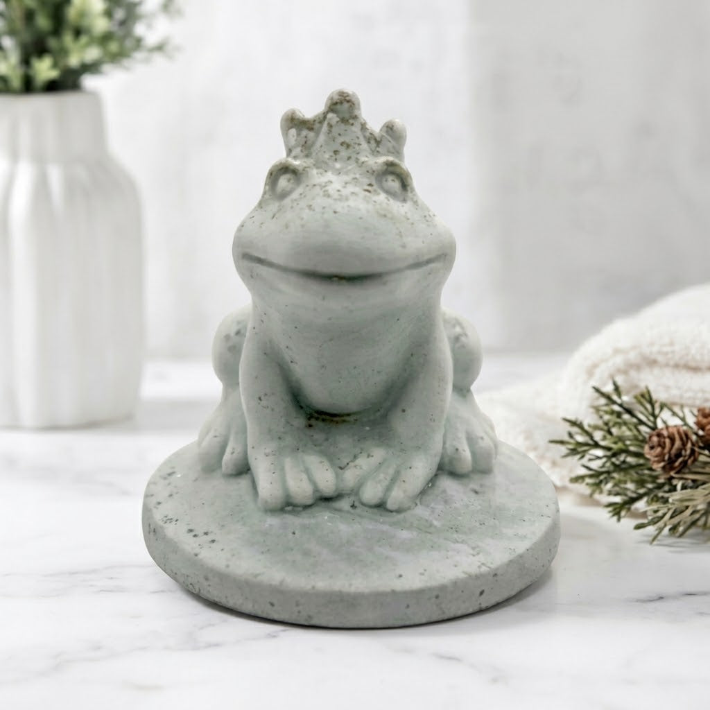 Handmade vegan soap featuring a frog prince with a crown on his head, displayed on a white background