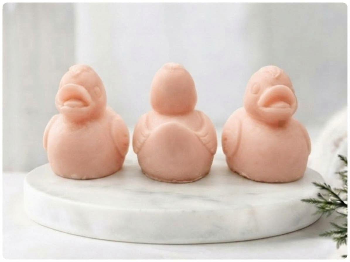 Soft pink handmade vegan soap duck gift set showcasing three sculpted duck figures.
