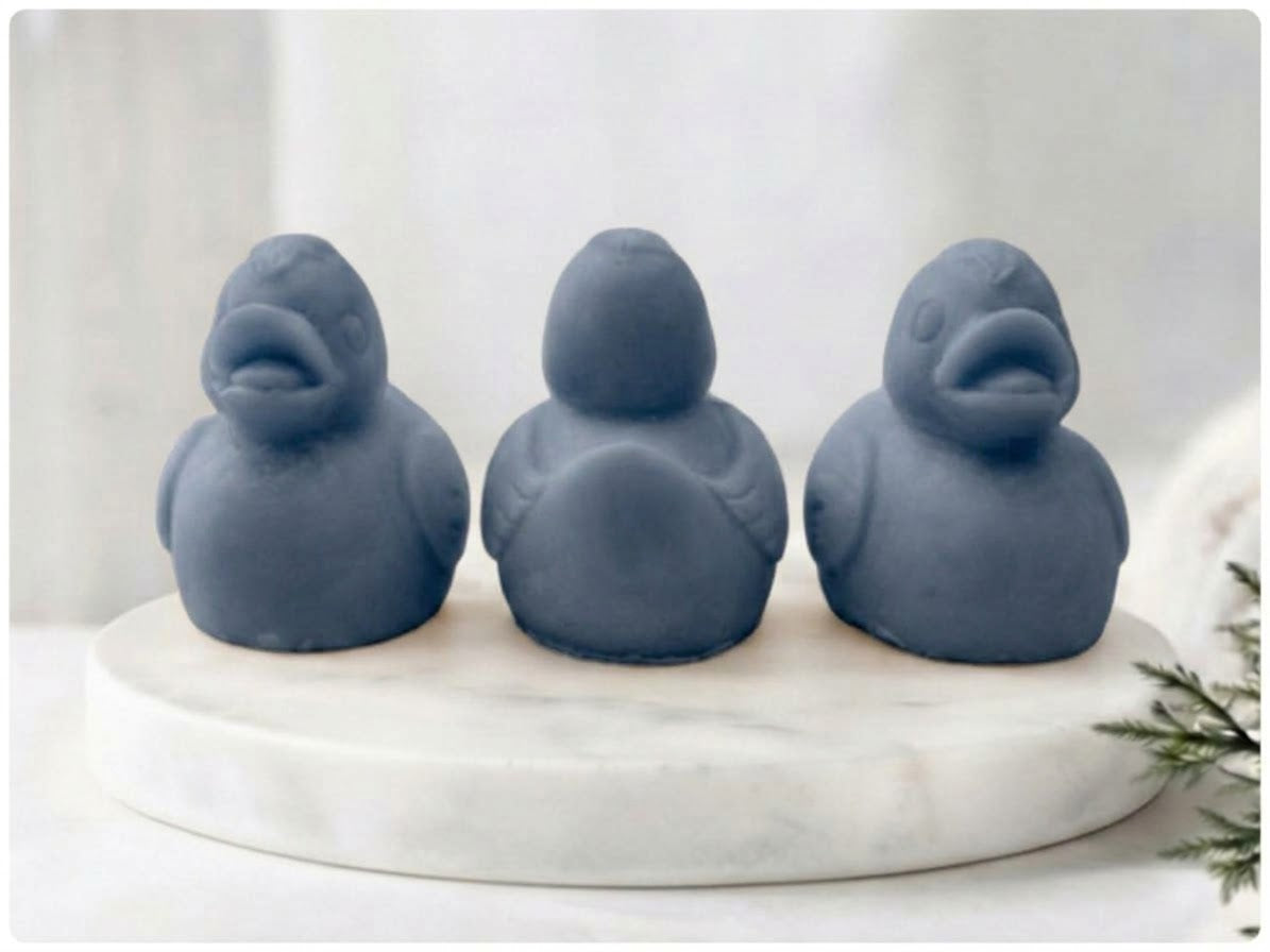 Charcoal grey vegan soap gift set featuring three detailed duck figurines displayed in front and back orientations.