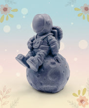 Load image into Gallery viewer, Handmade vegan soaps featuring a detailed astronaut / spaceman sitting  on the moon. crafted with natural French clays, activated charcoal and essential oils. a eco-friendly, zero waste gift that’s cruelty-free, skin-nourishing, and perfect for space lover gifts. gifts for him. Wrapped in beautiful eco friendly packaging. Small Business UK
