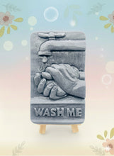Load image into Gallery viewer, Our unique “Wash Me” soap features a playful design of a pair of hands washing under a tap, complete with the words “WASH ME” imprinted at the bottom. Made from 100% vegan, cruelty-free ingredients, our soap is as kind to the planet as it is to your skin. Customise your bar by choosing your favourite colour and essential oil. 
