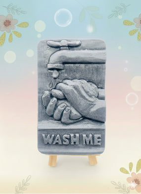 Our unique “Wash Me” soap features a playful design of a pair of hands washing under a tap, complete with the words “WASH ME” imprinted at the bottom. Made from 100% vegan, cruelty-free ingredients, our soap is as kind to the planet as it is to your skin. Customise your bar by choosing your favourite colour and essential oil. 