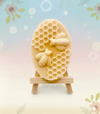 Handmade vegan soaps featuring two bees on honeycomb wrapped in beautiful eco friendly packaging crafted with natural French clays, activated charcoal and essential oils. a eco-friendly, zero waste gift that’s cruelty-free, skin-nourishing, and perfect gift for bee lovers and animal themed gifts. small business UK