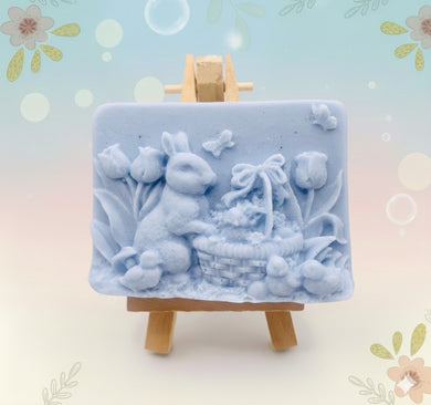 Handmade vegan soaps featuring the easter bunny with a basket full of chicks. , in beautiful eco friendly packaging. crafted with natural French clays, activated charcoal and essential oils. a eco-friendly, zero waste gift that’s cruelty-free, skin-nourishing, the perfect gift for easter and animal lovers. small business UK