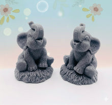 Load image into Gallery viewer, Handmade vegan soaps featuring a set of two baby elephants, gift boxed in beautiful eco friendly packaging. crafted with natural French clays, activated charcoal and essential oils. a eco-friendly, zero waste gift that’s cruelty-free, skin-nourishing, the perfect gift for elephant lovers or for animal lovers. small business UK
