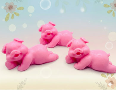 Handmade vegan soaps featuring a set of three cute laughing pigs, gift boxed in beautiful eco friendly packaging. crafted with natural French clays, activated charcoal and essential oils. a eco-friendly, zero waste gift that’s cruelty-free, skin-nourishing, and perfect for animal lovers, pig lovers and teacher appreciation gifts. small business UK