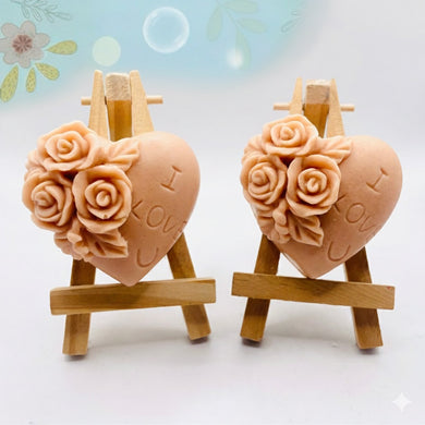 Handmade vegan soaps featuring a set of two love heart soaps with wording I LOVE U with flowers, gift boxed in beautiful eco friendly packaging. crafted with natural French clays, activated charcoal and essential oils. a eco-friendly, zero waste gift that’s cruelty-free, skin-nourishing, and perfect for romantic valentines gifts and anniversary gifts. small business UK