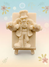 Load image into Gallery viewer, Handmade vegan soap featuring a Frankenstein monster with his arms reaching out  and packaged in beautiful eco friendly packaging. crafted with natural French clays, activated charcoal and essential oils. a eco-friendly, zero waste gift that’s cruelty-free, skin-nourishing, and perfect for horror lovers and halloween themed gifts. Small business UK
