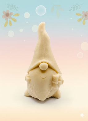 Handmade vegan soaps featuring a gorgeous gnome holding a gift in his hand packed in beautiful eco friendly packaging. crafted with natural French clays, activated charcoal and essential oils. a eco-friendly, zero waste gift that’s cruelty-free, skin-nourishing, the perfect gift for gnome lovers, Christmas gifts or for animal lover gifts. small business UK