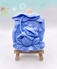 Load image into Gallery viewer, Frog Gift | cute frog gift | unique frog gift,Stocking filler, Frog &amp; Lily Pad Vegan Soap Wooden display easels are available to purchase on a separate listing  Meet our adorable Frog &amp; Lilypad soap! This charming little frog holds a lilypad leaf over his head like a tiny umbrella, hiding from the sun and ready to brighten up your day! modern gifts. handmade home style. eco conscious gifts. zero waste gift. handmade home style. modern gift ideas.
