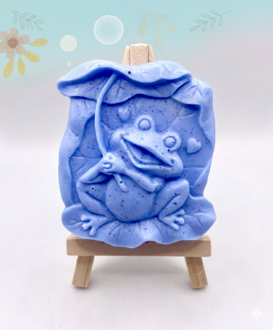 Frog Gift | cute frog gift | unique frog gift,Stocking filler, Frog & Lily Pad Vegan Soap Wooden display easels are available to purchase on a separate listing  Meet our adorable Frog & Lilypad soap! This charming little frog holds a lilypad leaf over his head like a tiny umbrella, hiding from the sun and ready to brighten up your day! modern gifts. handmade home style. eco conscious gifts. zero waste gift. handmade home style. modern gift ideas.