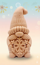 Load image into Gallery viewer, Handmade vegan soaps featuring a christmas gnome holding a snowflake in beautiful eco friendly packaging crafted with natural French clays, activated charcoal and essential oils. a eco-friendly, zero waste gift that’s cruelty-free, skin-nourishing, and perfect for gnome lovers and christmas themed gifts. small business UK
