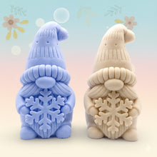 Load image into Gallery viewer, Handmade vegan soaps featuring a christmas gnome holding a snowflake in beautiful eco friendly packaging crafted with natural French clays, activated charcoal and essential oils. a eco-friendly, zero waste gift that’s cruelty-free, skin-nourishing, and perfect for gnome lovers and christmas themed gifts. small business UK
