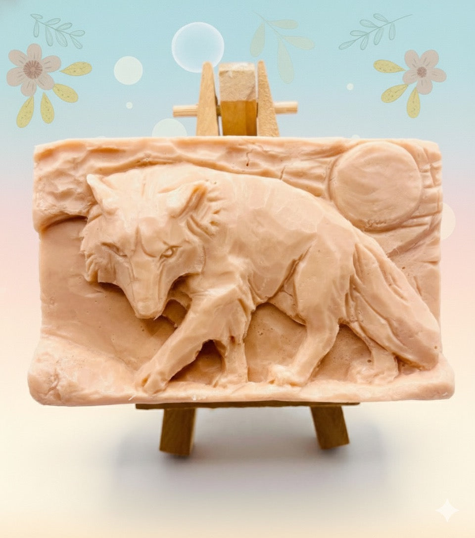 Handmade vegan soaps featuring a wolf prowling with the moon behind him, in beautiful eco friendly packaging. crafted with natural French clays, activated charcoal and essential oils. a eco-friendly, zero waste gift that’s cruelty-free, skin-nourishing, the perfect gift for wolf lovers, or for animal lover gifts. small business UK