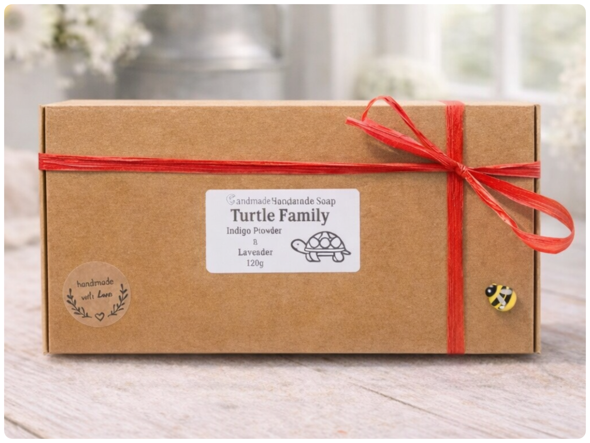 Gift box with a red ribbon and 'Turtle Family' label on a wooden surface