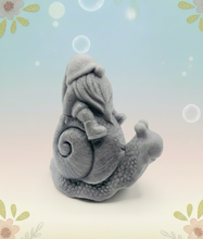 Load image into Gallery viewer, Handmade vegan soaps featuring a detailed snail with a gnome catching a ride on his back soap. crafted with natural French clays, activated charcoal and essential oils. a eco-friendly, zero waste gift that’s cruelty-free, skin-nourishing, and perfect for turtle lovers and gnome lover gifts. small business UK
