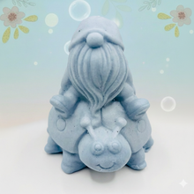 Load image into Gallery viewer, Handmade vegan soaps featuring a detailed ladybug with a gnome catching a ride on his back soap. crafted with natural French clays, activated charcoal and essential oils. a eco-friendly, zero waste gift that’s cruelty-free, skin-nourishing, and perfect for turtle lovers and gnome lover gifts. small business UK
