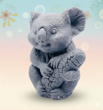 Load image into Gallery viewer, Handmade vegan soaps featuring a chunky koala bear climbing a tree packaged in beautiful eco friendly packaging crafted with natural French clays, activated charcoal and essential oils. a eco-friendly, zero waste gift that’s cruelty-free, skin-nourishing, and perfect for koala bear lovers and animal themed gifts. small business UK
